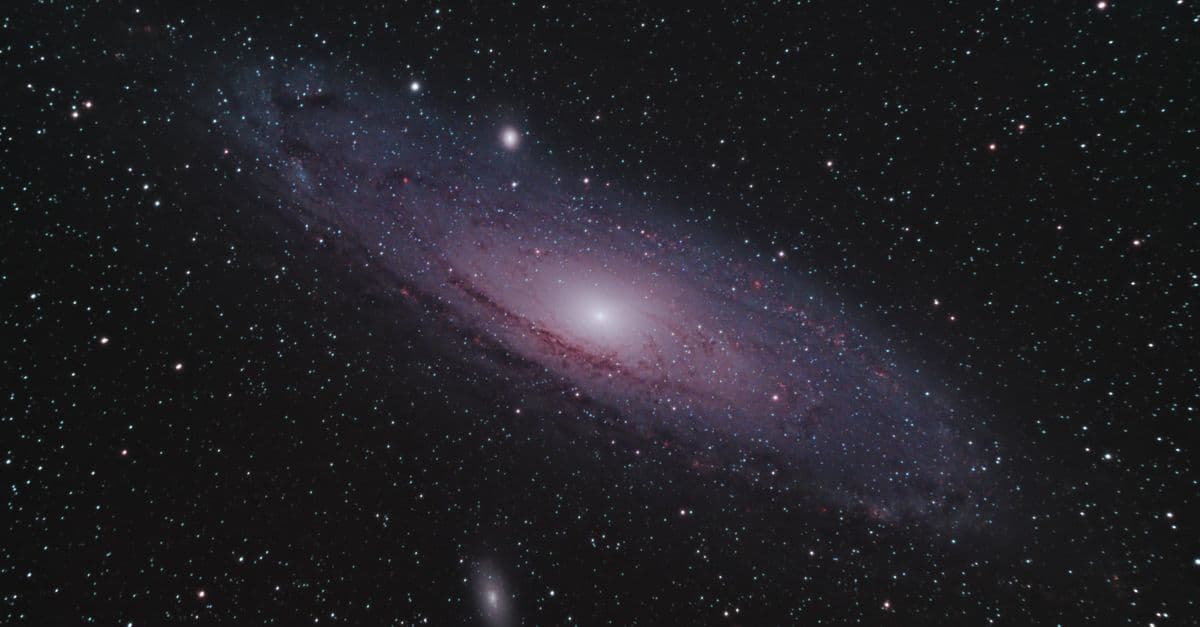 Capture of the Andromeda Galaxy surrounded by countless stars in a serene night sky.