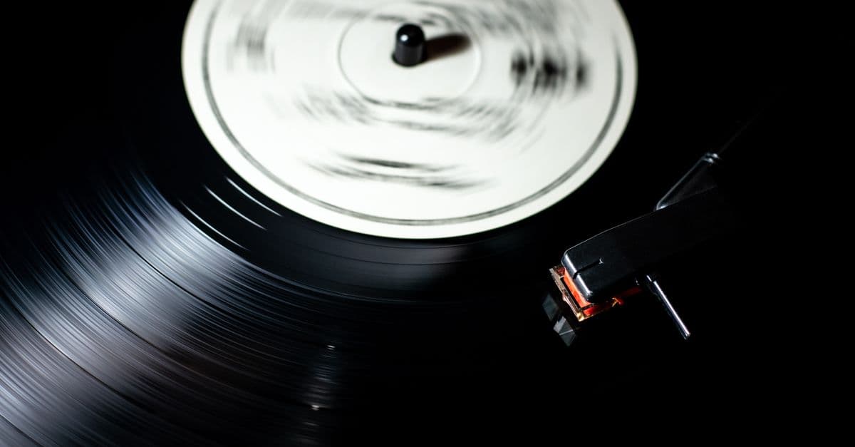 Close-up of a vintage vinyl record spinning on a turntable.