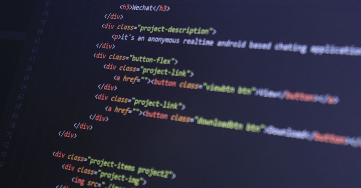 Close-up of HTML code with syntax highlighting on a computer monitor.