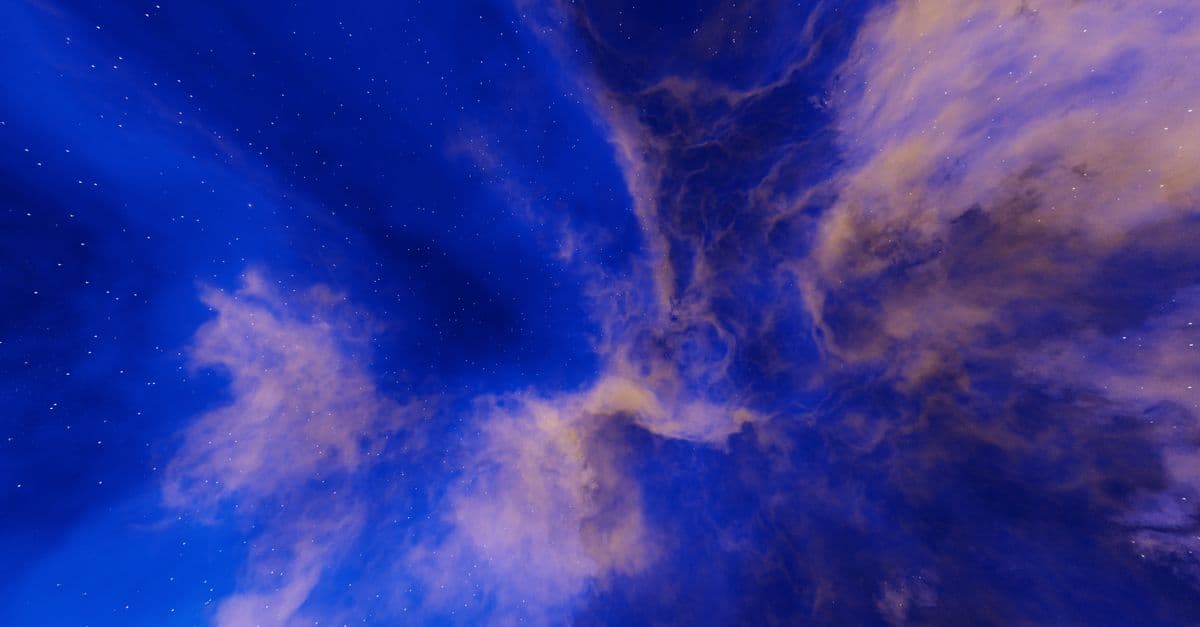 A mesmerizing cosmic scene with vivid blue clouds and shimmering stars. Perfect for creative backgrounds.