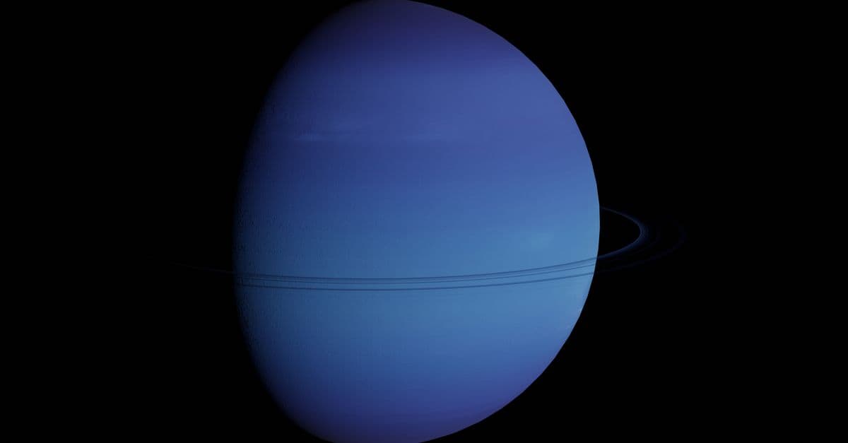 Vibrant blue image of Neptune and its rings in the vastness of space.