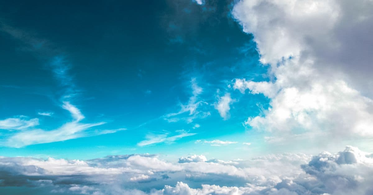 Breathtaking view of clouds with vibrant blue sky above, offering a dreamy skyscape
