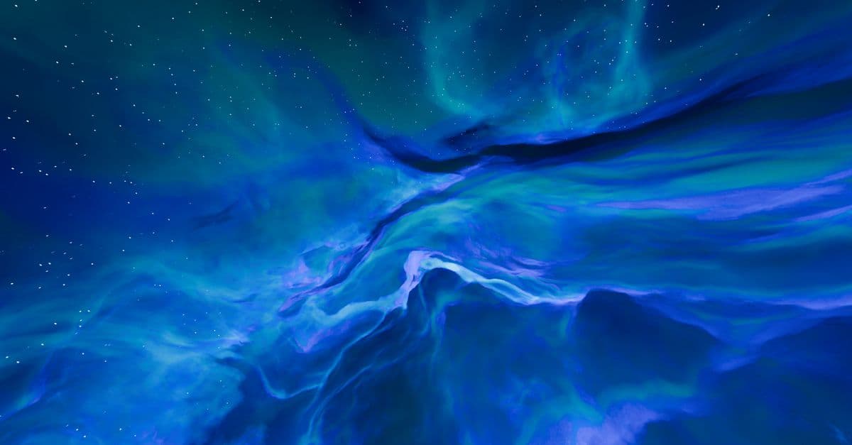 A mesmerizing deep space scene of a blue and purple nebula with stars.