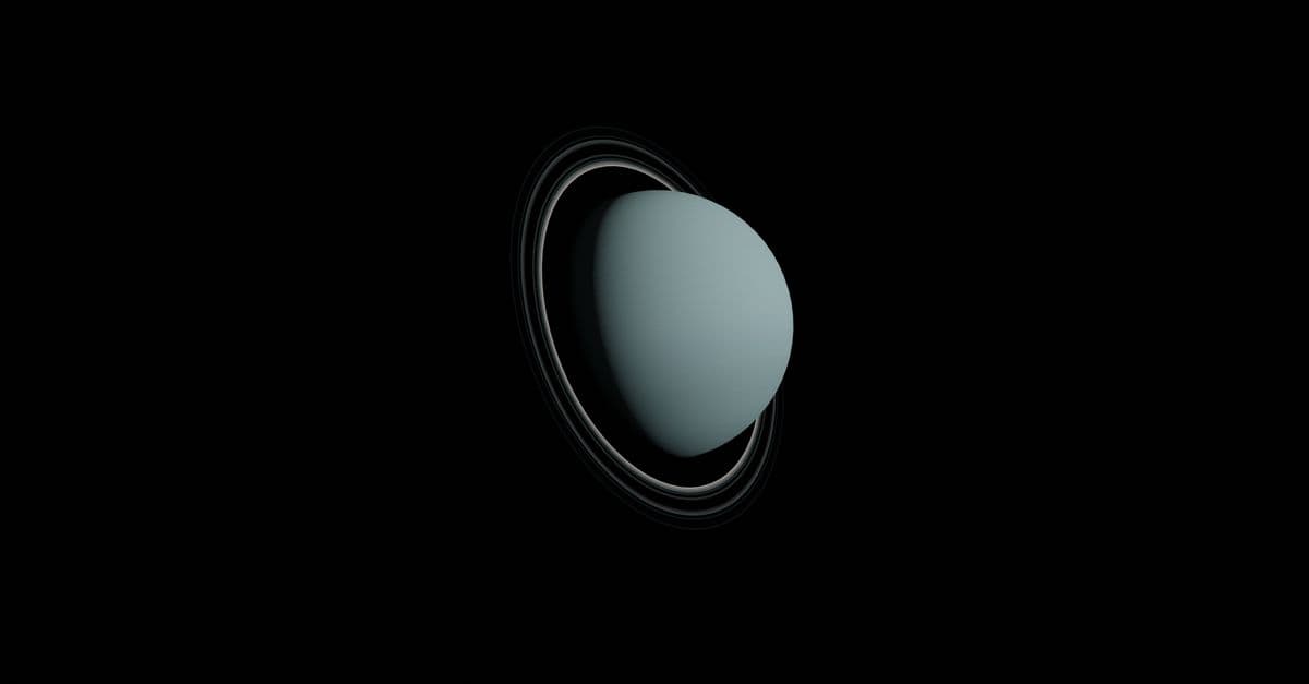 Digitally generated image of planet Uranus with rings in outer space.