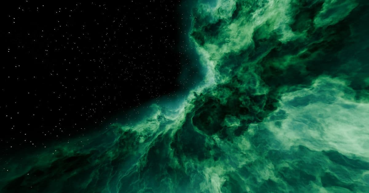 Vibrant green nebula with starry background, showcasing cosmic beauty.