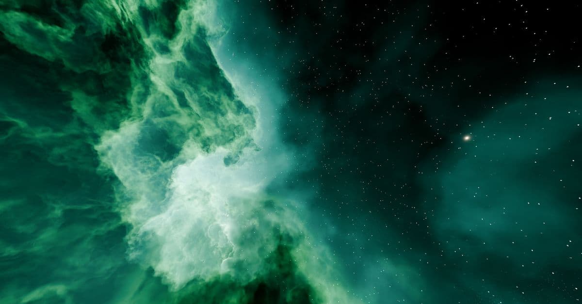 Beautiful green nebula in deep space with stars shining brightly.