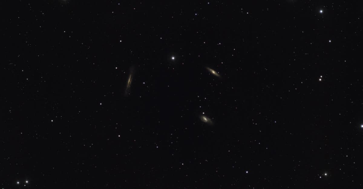 A breathtaking view of distant galaxies amidst a starry night sky filled with countless stars.