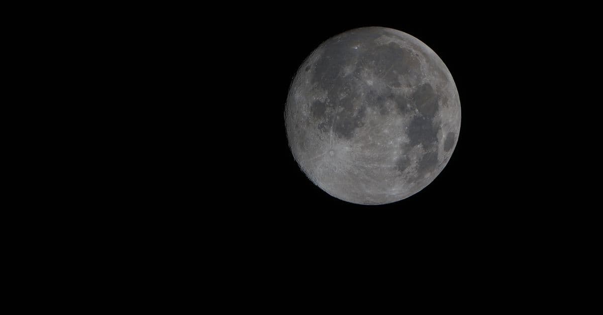Captivating image of the full moon set against a deep black night sky.
