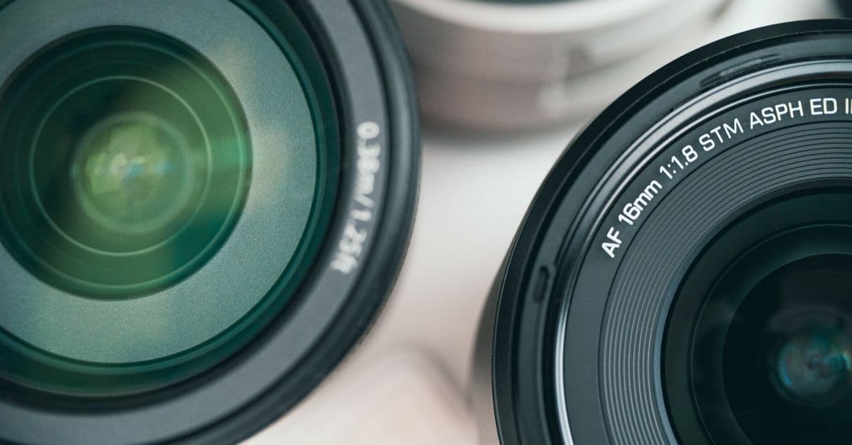 Detailed close-up shot of camera lenses showcasing optical equipment for photography.
