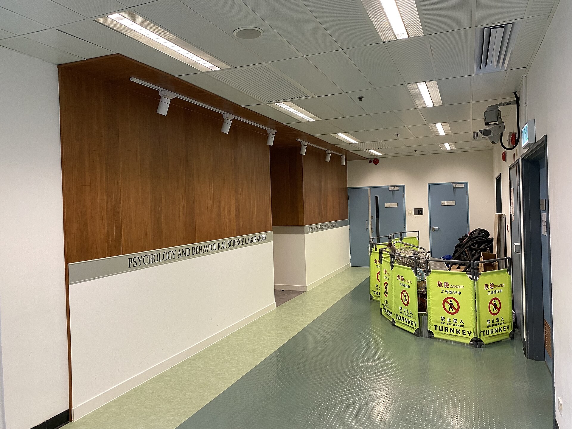 A psychology and behavioural-science laboratory corridor at a university campus.